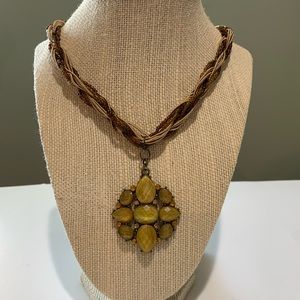 Stunning beaded brown tones rope Necklace w/ green/yellow charm. 20”. Charm 2”